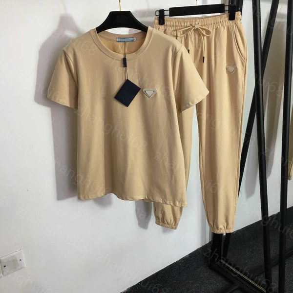 23ss women pants sets casual suit womens designer clothing metal logo decorative short sleeve t-shirt elastic waist cinched feet casual pant, White
23ss women pants sets casual suit womens designer clothing metal logo decorative short sleeve t-shirt elastic waist cinched feet casual pant, White