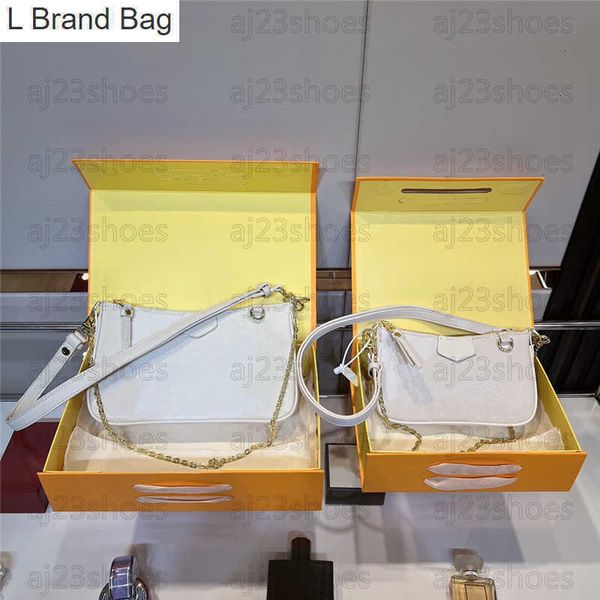 l brand bag easy pouch on strap m81066 shoulder bags embossed empreinte leather sleek design black creme white small women luxurys designers
l brand bag easy pouch on strap m81066 shoulder bags embossed empreinte leather sleek design black creme white small women luxurys designers