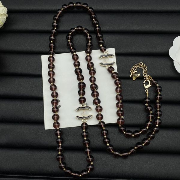 New Double-letter Enamel Necklace Retro High Version Black Transparent Pearl Sweater Chain Small Fragrant Wind Long Money Decoration
New Double-letter Enamel Necklace Retro High Version Black Transparent Pearl Sweater Chain Small Fragrant Wind Long Money Decoration