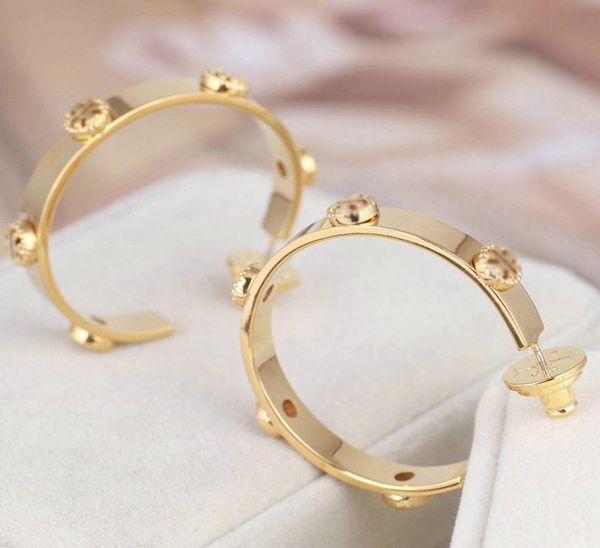 real 18k gold plated gold huggie hoop earrings brand gold button logo fashion earrings8529708, Golden;silver
real 18k gold plated gold huggie hoop earrings brand gold button logo fashion earrings8529708, Golden;silver