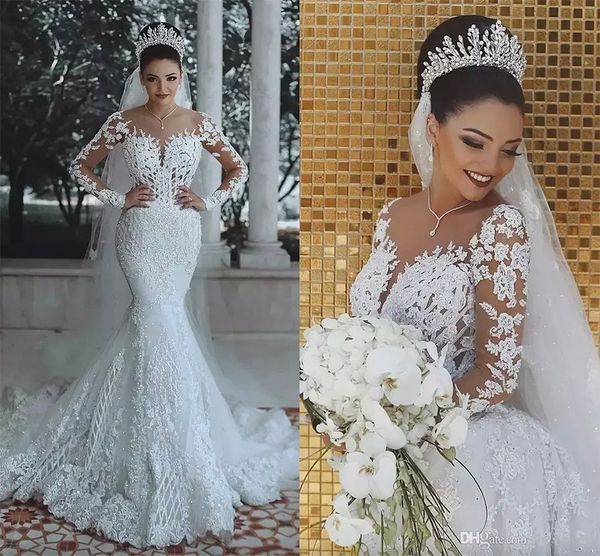 dubai luxury white crystals mermaid wedding dresses sheer neck long sleeves wedding bridal gowns with detachable overskirts train
dubai luxury white crystals mermaid wedding dresses sheer neck long sleeves wedding bridal gowns with detachable overskirts train