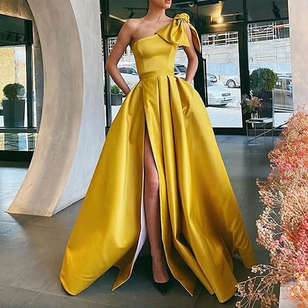 elegant yellow one shoulder bow prom dresses with pockets 2023 side high slit a-line long formal evening gowns party dress, Black;red
elegant yellow one shoulder bow prom dresses with pockets 2023 side high slit a-line long formal evening gowns party dress, Black;red