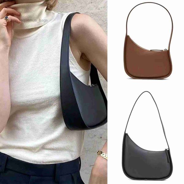 the row half moon bag in smooth leather women designer with flat shoulder strap and curved zipper closure clutch tote suded lining underarm
the row half moon bag in smooth leather women designer with flat shoulder strap and curved zipper closure clutch tote suded lining underarm