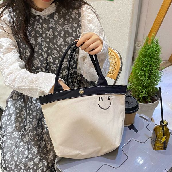 french minority portable canvas bag student lunch box bag new versatile designer tote bag
french minority portable canvas bag student lunch box bag new versatile designer tote bag