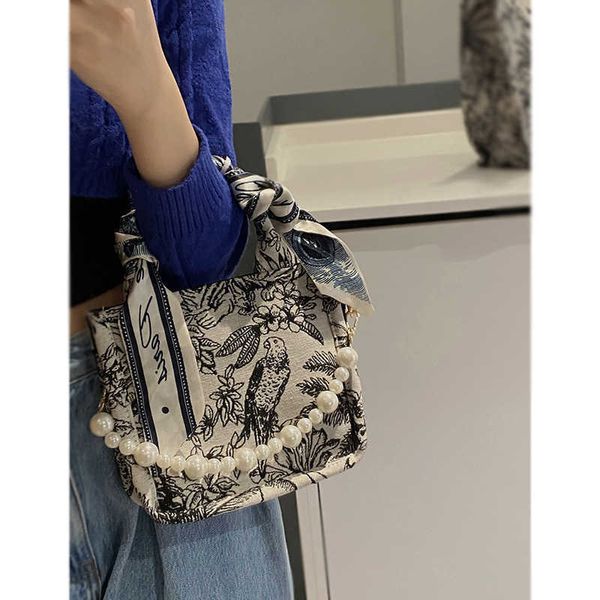 pearl bag women's summer new fashion portable tote bag french niche print messenger bag canvas bag
pearl bag women's summer new fashion portable tote bag french niche print messenger bag canvas bag