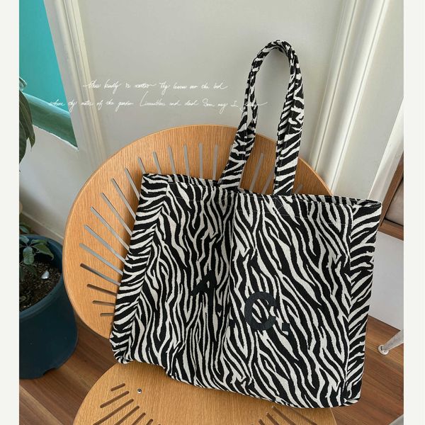 japanese and spring/summer new apc zebra canvas bag one shoulder handbag french high capacity tote bag tide
japanese and spring/summer new apc zebra canvas bag one shoulder handbag french high capacity tote bag tide