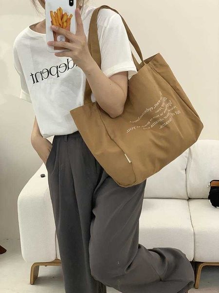 versatile commuter to work large capacity zipper letter tote bag one shoulder brown canvas bag french design female
versatile commuter to work large capacity zipper letter tote bag one shoulder brown canvas bag french design female