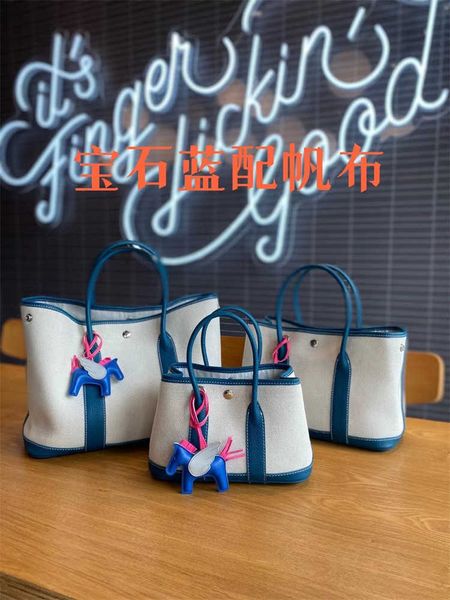 designer herbags mas s tote bags garden party new genuine leather women's bag canvas with layer cowhide fashion handheld one shoulder c
designer herbags mas s tote bags garden party new genuine leather women's bag canvas with layer cowhide fashion handheld one shoulder c