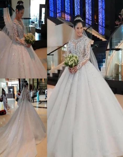 luxurious muslim ball gown wedding dresses jewel neck lace appliques beads sequins long sleeves cathedral train arabic formal brid4519271, White
luxurious muslim ball gown wedding dresses jewel neck lace appliques beads sequins long sleeves cathedral train arabic formal brid4519271, White