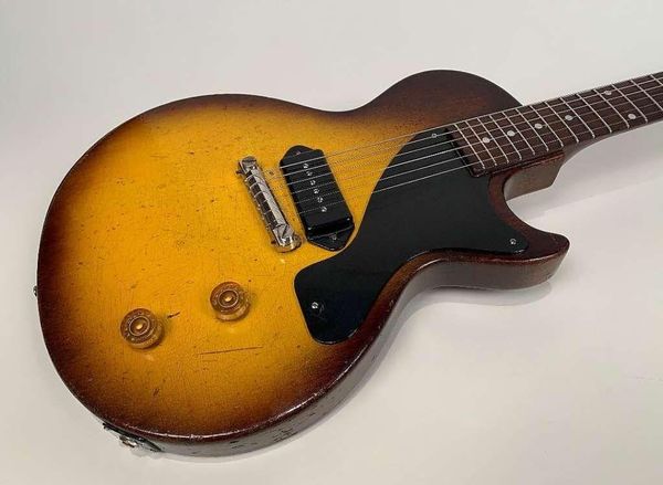 tobacco sunburst relic junior electric guitar black p90 dog ear pickup black pickguard wrap around tailpiece single cutaway white tuners
tobacco sunburst relic junior electric guitar black p90 dog ear pickup black pickguard wrap around tailpiece single cutaway white tuners