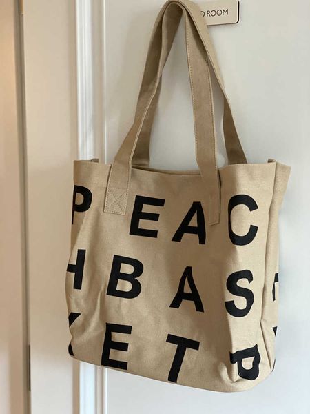 canvas bag with large capacity new super large letter shopping student girls small group holding bucket tote bag trend
canvas bag with large capacity new super large letter shopping student girls small group holding bucket tote bag trend
