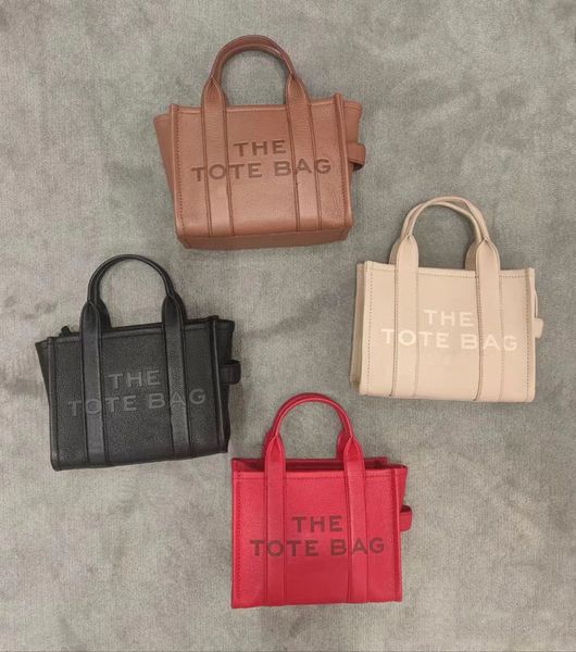 the tote bag leather embossing letter handbag capacity shopping bag women men designer shoulder bag 26cm 33cm multiple colors
the tote bag leather embossing letter handbag capacity shopping bag women men designer shoulder bag 26cm 33cm multiple colors