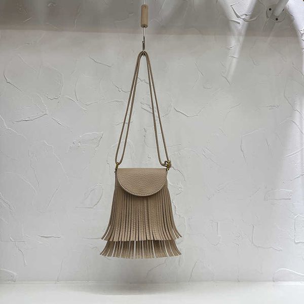 2022 design sense korean soft leather tassel bucket bag with lychee pattern fashion fried street versatile skew straddle small bag 230708
2022 design sense korean soft leather tassel bucket bag with lychee pattern fashion fried street versatile skew straddle small bag 230708