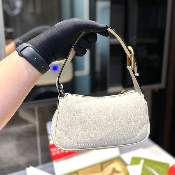 the new folding underarm bag the plane can be worn on one shoulder and the small one is actually super-sized and the shoulder strap is adjus