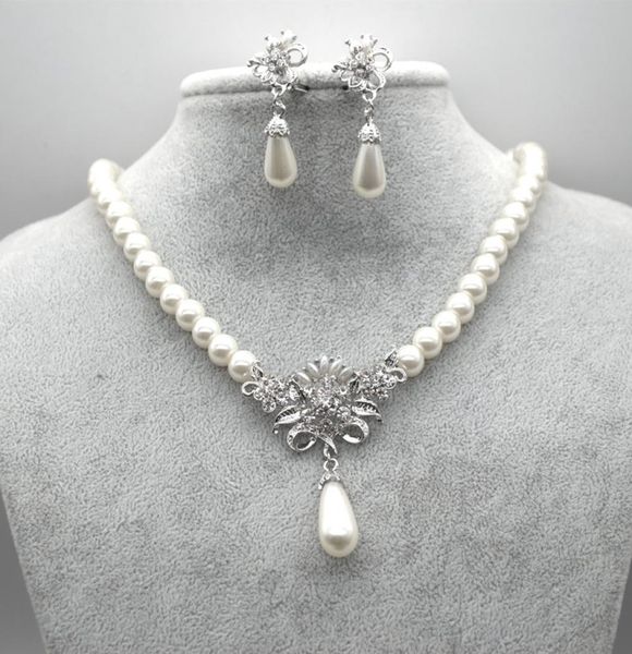 rhodium silver plated cream glass pearl and rhinestone crystal floral bridal necklace and stud earrings jewelry sets6922394
rhodium silver plated cream glass pearl and rhinestone crystal floral bridal necklace and stud earrings jewelry sets6922394
