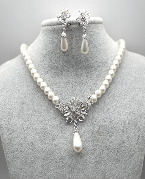 rhodium silver plated cream glass pearl and rhinestone crystal floral bridal necklace and stud earrings jewelry sets4657786
rhodium silver plated cream glass pearl and rhinestone crystal floral bridal necklace and stud earrings jewelry sets4657786