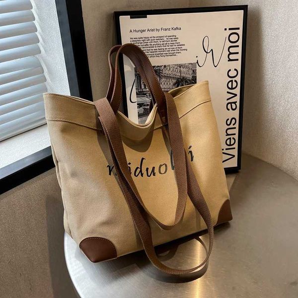 ins style niche design canvas bag women's high-class big bag shoulder bag large capacity versatile commuter tote bag
ins style niche design canvas bag women's high-class big bag shoulder bag large capacity versatile commuter tote bag