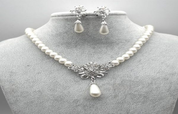 rhodium silver plated cream glass pearl and rhinestone crystal floral bridal necklace and stud earrings jewelry sets1377819
rhodium silver plated cream glass pearl and rhinestone crystal floral bridal necklace and stud earrings jewelry sets1377819