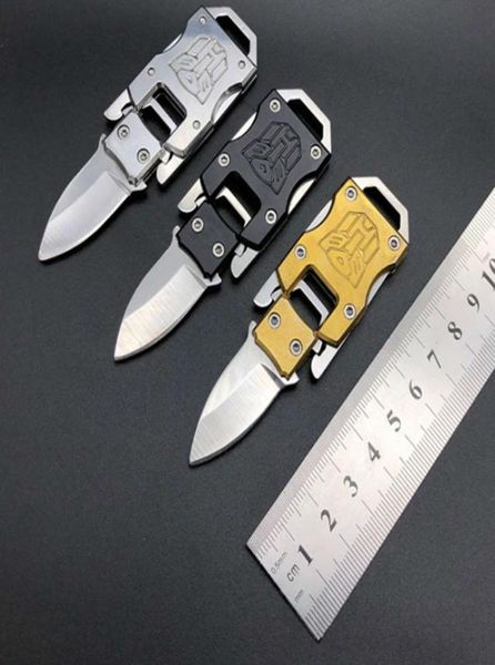 transformers mini folding outdoor portable tactical survival keychain knife1274259, Golden;silver 
transformers mini folding outdoor portable tactical survival keychain knife1274259, Golden;silver