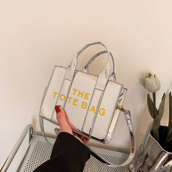 factory wholesale handbag trendy 2023 new fashion mini tote bag with glossy lacquer leather letter one shoulder crossbody
factory wholesale handbag trendy 2023 new fashion mini tote bag with glossy lacquer leather letter one shoulder crossbody