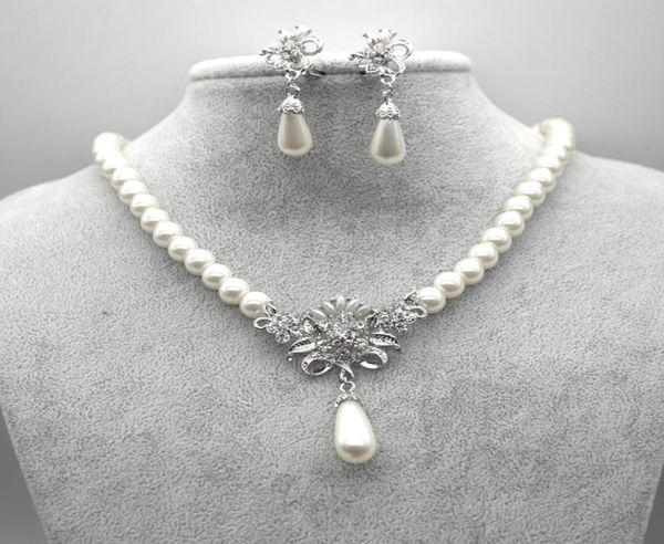 rhodium silver plated cream glass pearl and rhinestone crystal floral bridal necklace and stud earrings jewelry sets9025473
rhodium silver plated cream glass pearl and rhinestone crystal floral bridal necklace and stud earrings jewelry sets9025473
