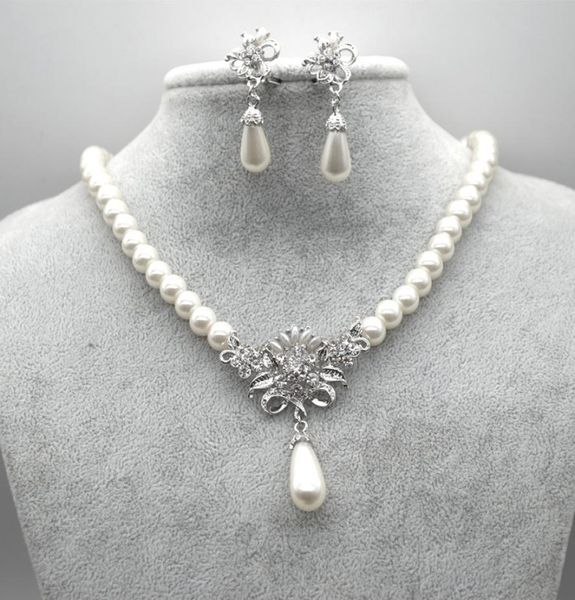 rhodium silver plated cream glass pearl and rhinestone crystal floral bridal necklace and stud earrings jewelry sets4242185
rhodium silver plated cream glass pearl and rhinestone crystal floral bridal necklace and stud earrings jewelry sets4242185