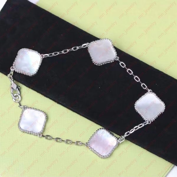 classic four-leaf clover bracelet in silver-tone. pretty white shell five motif designer bracelet. exclusive jewelry., Black
classic four-leaf clover bracelet in silver-tone. pretty white shell five motif designer bracelet. exclusive jewelry., Black