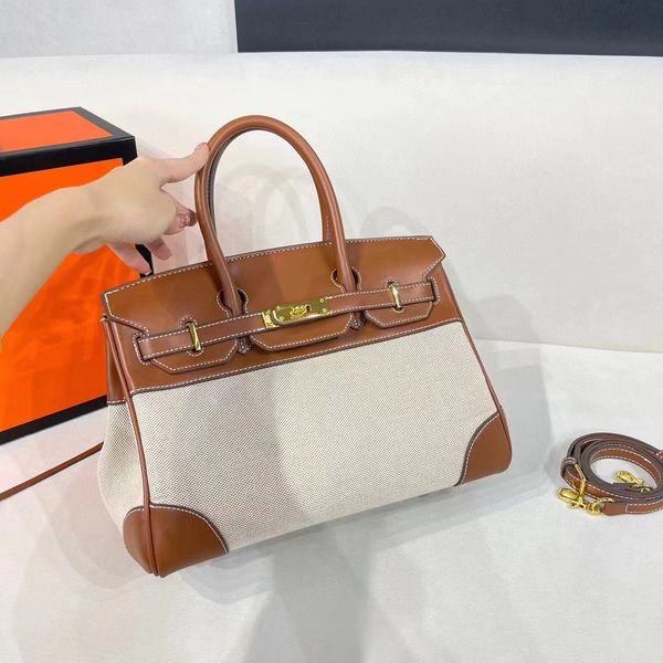 5a fashion handbag women's handbag shoulder bag cowhide leather cloth gold handbag silk scarf style strap birkin bag
5a fashion handbag women's handbag shoulder bag cowhide leather cloth gold handbag silk scarf style strap birkin bag