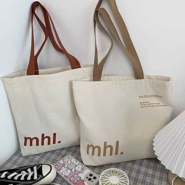 summer new canvas bag women's small letter printed shoulder bag large capacity commuter tote bag
summer new canvas bag women's small letter printed shoulder bag large capacity commuter tote bag
