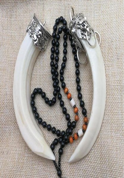 natural wild boar tooth pendant inlaid with silver accessories animal teeth pendant personal hand piece to ward off evil spirits5502667
natural wild boar tooth pendant inlaid with silver accessories animal teeth pendant personal hand piece to ward off evil spirits5502667