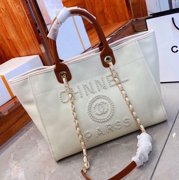 fashion womens beach bag shoulder bag canvas designer bag shopping bag with chain luxury handbag linen pearl print crossbody bag travel bag
fashion womens beach bag shoulder bag canvas designer bag shopping bag with chain luxury handbag linen pearl print crossbody bag travel bag