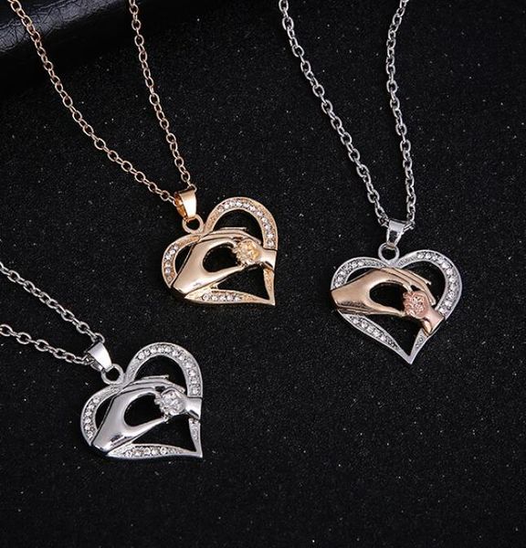 whole gold silver fashion hand pendant necklace with crystals family love heart pendant necklaces women quality jewlry9484684
whole gold silver fashion hand pendant necklace with crystals family love heart pendant necklaces women quality jewlry9484684