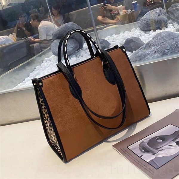 leather bags letter tote bag on the go large zipper inner patch pocket double handle borse metal parts borse embossed grain luxurys handbags
leather bags letter tote bag on the go large zipper inner patch pocket double handle borse metal parts borse embossed grain luxurys handbags