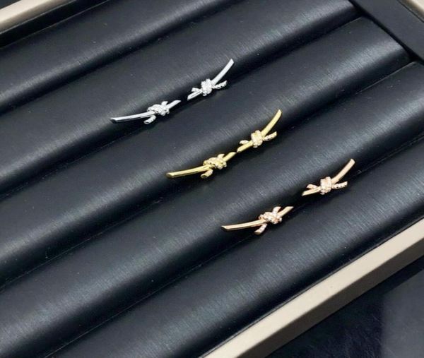 europe america fashion lady women brass engraved t letter setting diamond 18k gold plated xshaped knot stud earrings6948705, Golden;silver 
europe america fashion lady women brass engraved t letter setting diamond 18k gold plated xshaped knot stud earrings6948705, Golden;silver