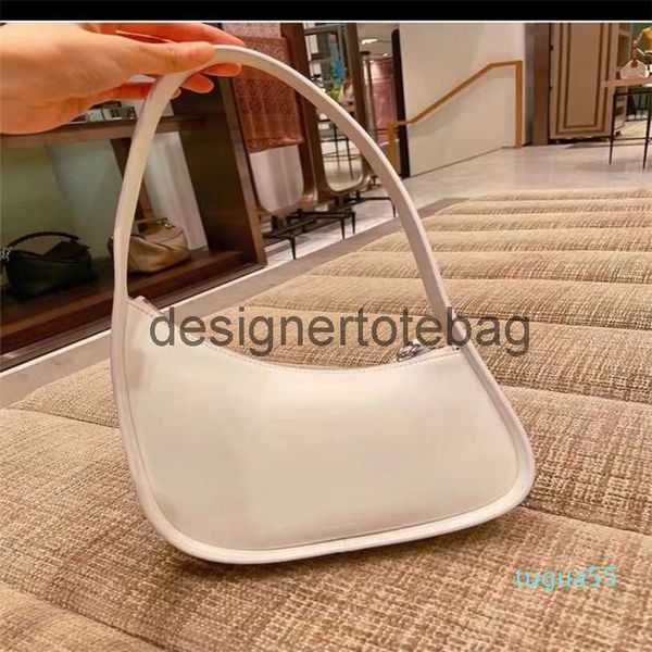 the row half moon bag in smooth leather women designer with flat shoulder strap and curved zipper
the row half moon bag in smooth leather women designer with flat shoulder strap and curved zipper