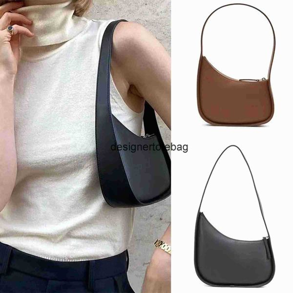 the row half moon bag in smooth leather women designer with flat shoulder strap and curved zipper closure clutch tote suded lining underarm
the row half moon bag in smooth leather women designer with flat shoulder strap and curved zipper closure clutch tote suded lining underarm