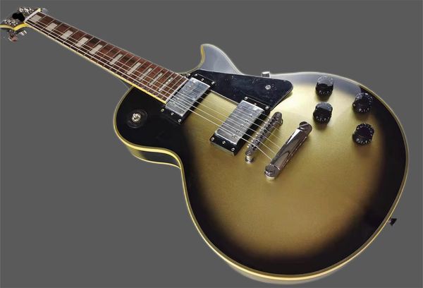 custom electric guitar, yellow logo and yellow bindings, vintage silver, silver accessories, bright lights, mahogany body, stock
custom electric guitar, yellow logo and yellow bindings, vintage silver, silver accessories, bright lights, mahogany body, stock