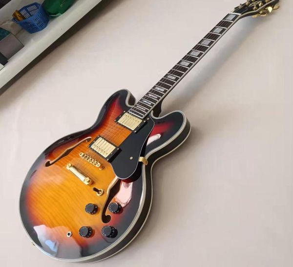 memphis 335 semi hollow sunset jazz electric guitar flame maple veneer side and back shell inlay custom binding4363224
memphis 335 semi hollow sunset jazz electric guitar flame maple veneer side and back shell inlay custom binding4363224