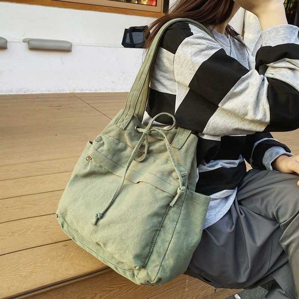 simple and large capacity female student campus canvas shoulder bag version fashion trendy underarm drawstring fabric bag tote bag
simple and large capacity female student campus canvas shoulder bag version fashion trendy underarm drawstring fabric bag tote bag
