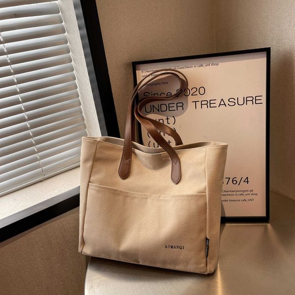 spring new one shoulder canvas bag handheld fashion versatile commuter college student large capacity tote bag
spring new one shoulder canvas bag handheld fashion versatile commuter college student large capacity tote bag