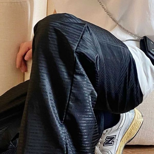spring and summer classic triangle logo letter printing black pants, men and women of the same style, high waist loose version, classic leis
spring and summer classic triangle logo letter printing black pants, men and women of the same style, high waist loose version, classic leis