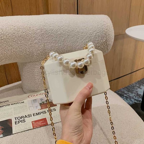 shoulder bags acrylic box handbags for elegant women pearl beads decor lock chain shoulder bag luxury designer purses transparent makeup bag
shoulder bags acrylic box handbags for elegant women pearl beads decor lock chain shoulder bag luxury designer purses transparent makeup bag