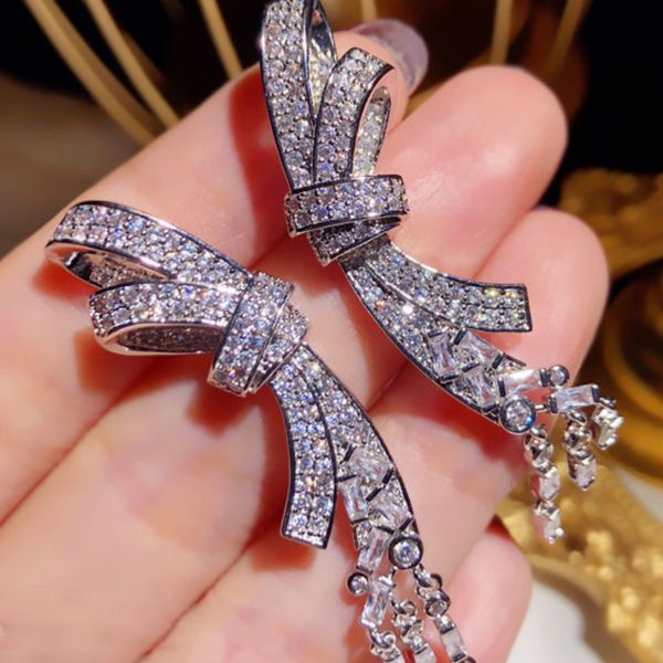 super sparkling zircon bow tassel pendant with long earrings and earrings, feminine and versatile silver needle crystal earrings, Golden;silver
super sparkling zircon bow tassel pendant with long earrings and earrings, feminine and versatile silver needle crystal earrings, Golden;silver