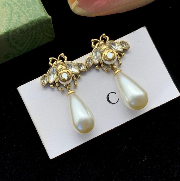 classic designer pearl dangle stud earring vintage fashion letter bee eardrop earrings for women lady selected lovers gifts, Silver
classic designer pearl dangle stud earring vintage fashion letter bee eardrop earrings for women lady selected lovers gifts, Silver