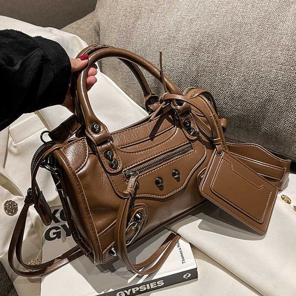 a niche design for women's bags a new fashion portable rivet locomotive bag with versatile texture and shoulder crossbody purses
a niche design for women's bags a new fashion portable rivet locomotive bag with versatile texture and shoulder crossbody purses