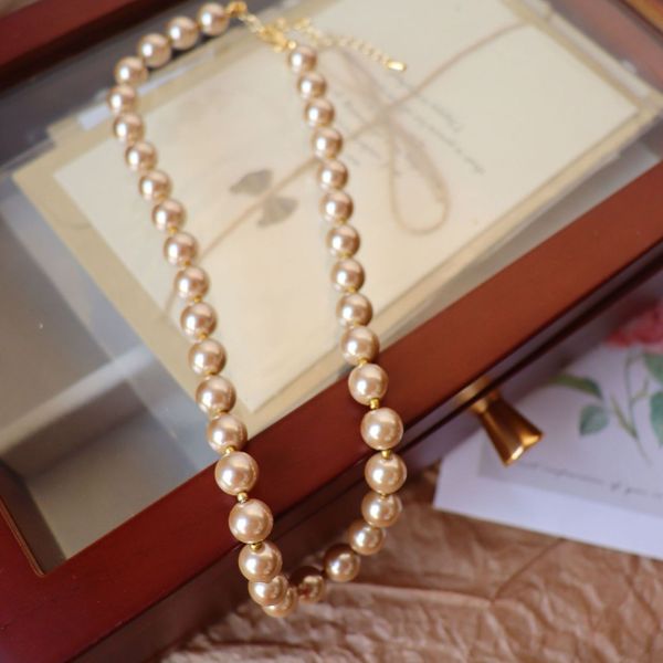 women's swimwear american medieval champagne gold glazed pearl short necklace for women with elegance 230724, White;black
women's swimwear american medieval champagne gold glazed pearl short necklace for women with elegance 230724, White;black