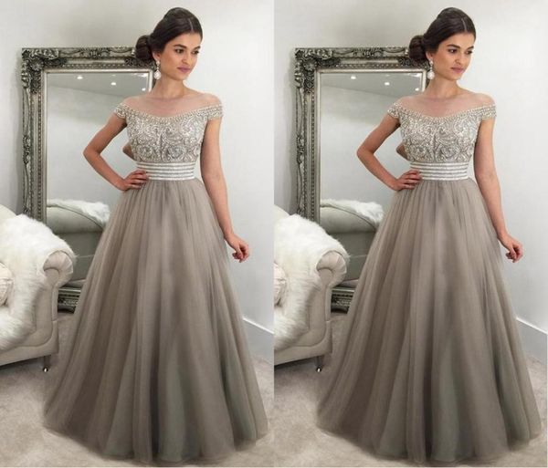 2017 elegant silver gray evening dresses off shoulder cap sleeves crystal beaded tulle puffy saudi arabic formal evening gowns pro2704750, Black;red
2017 elegant silver gray evening dresses off shoulder cap sleeves crystal beaded tulle puffy saudi arabic formal evening gowns pro2704750, Black;red