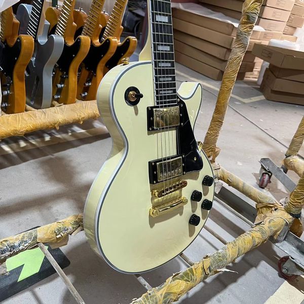 custom cream yellow electric guitar solid color body, auto-tuning bridge, gold hardware, ing
custom cream yellow electric guitar solid color body, auto-tuning bridge, gold hardware, ing