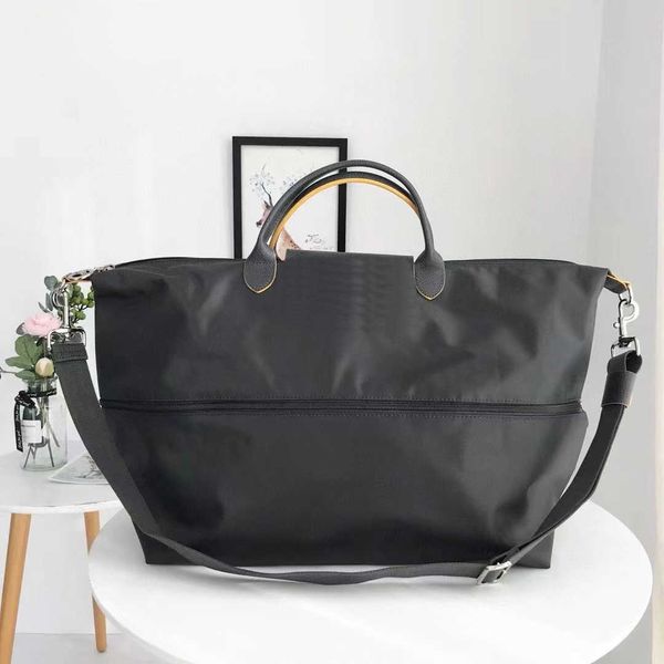 embroidered duffle bags nylon oversized travel bag for men women foldable luggage single shoulder cross body bag 230715
embroidered duffle bags nylon oversized travel bag for men women foldable luggage single shoulder cross body bag 230715