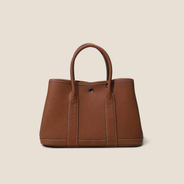 classic garden party tote bag layer new cowhide lychee patterned togo garden bag with large capacity genuine leather carrying for women sing
classic garden party tote bag layer new cowhide lychee patterned togo garden bag with large capacity genuine leather carrying for women sing